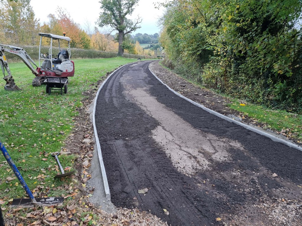 This is a large driveway which is in the process of having a tar and chip driveway installed on by NS Driveways Billingshurst